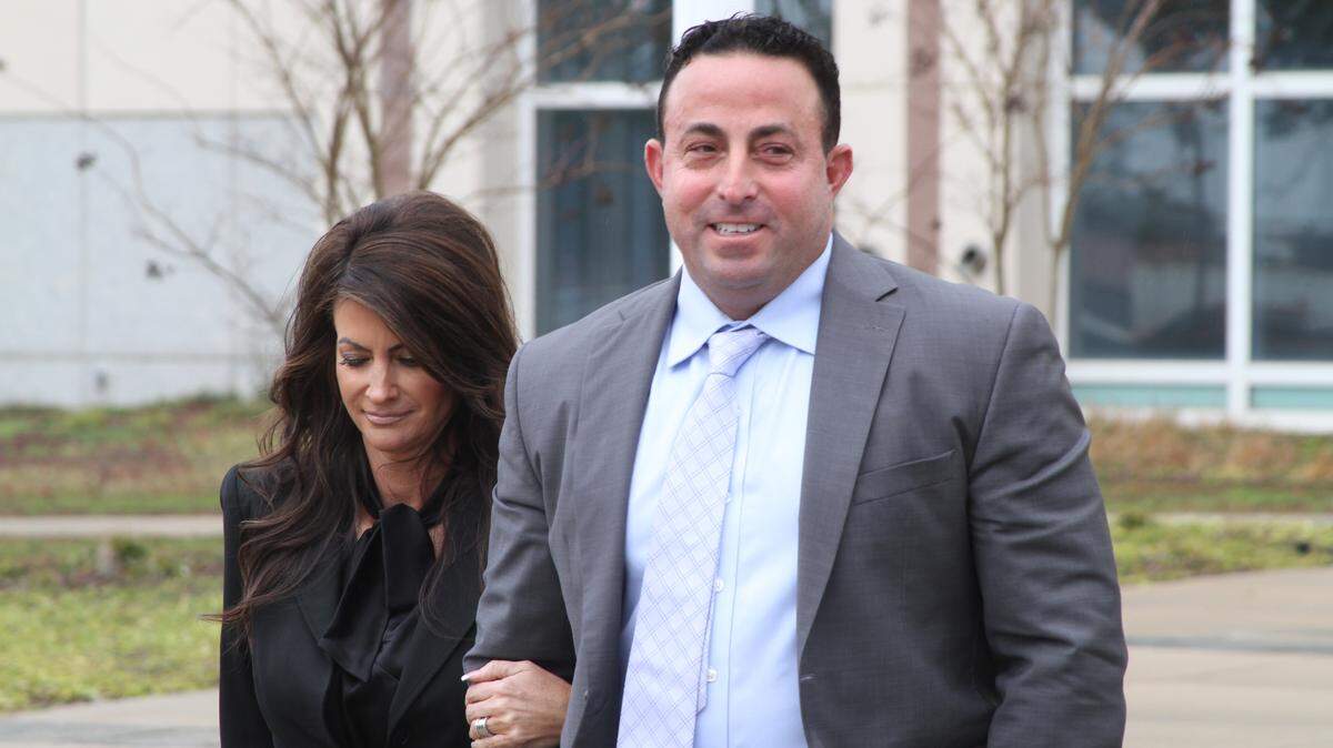 Ivan Spinner leaves U.S. District Court in Gulfport with wife Kelly after a sentencing hearing Thursday morning. Spinner and eight others who pleaded guilty to a conspiracy to rig bids at real estate auctions in South Mississippi. U.S. District Judge Louis Guirola will sentence most of them Thursday afternoon.