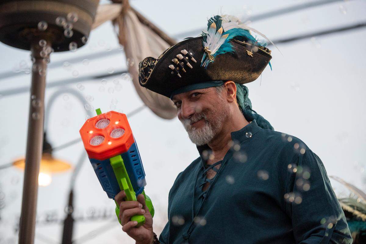 A member of Mystic Krewe of the Seahorse uses a bubble gun during the krewe’s Lundi Gras parade in Bay St. Louis on Monday, March 3, 2025.