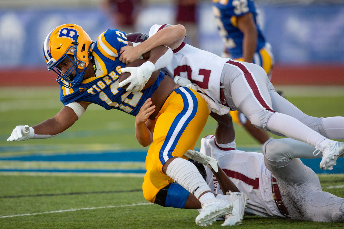 Bay High’s Avery Harris gets tackled as he runs the ball during a game between Bay High and Long Beach at Tiger Stadium in Bay St. Louis on Friday, Sept. 13, 2024.