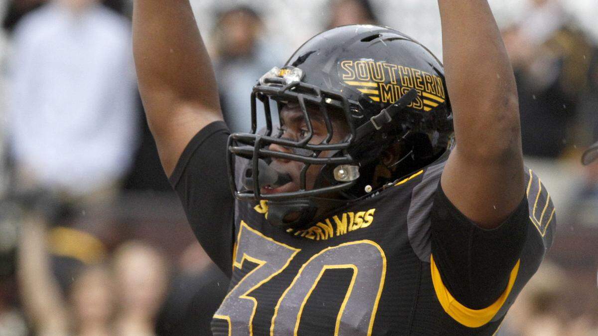 TIM ISBELL/SUN HERALD 
 Southern Miss running back Jalen Richard signals touchdown after scoring against Old Dominion, Saturday, Nov. 21, 2015.