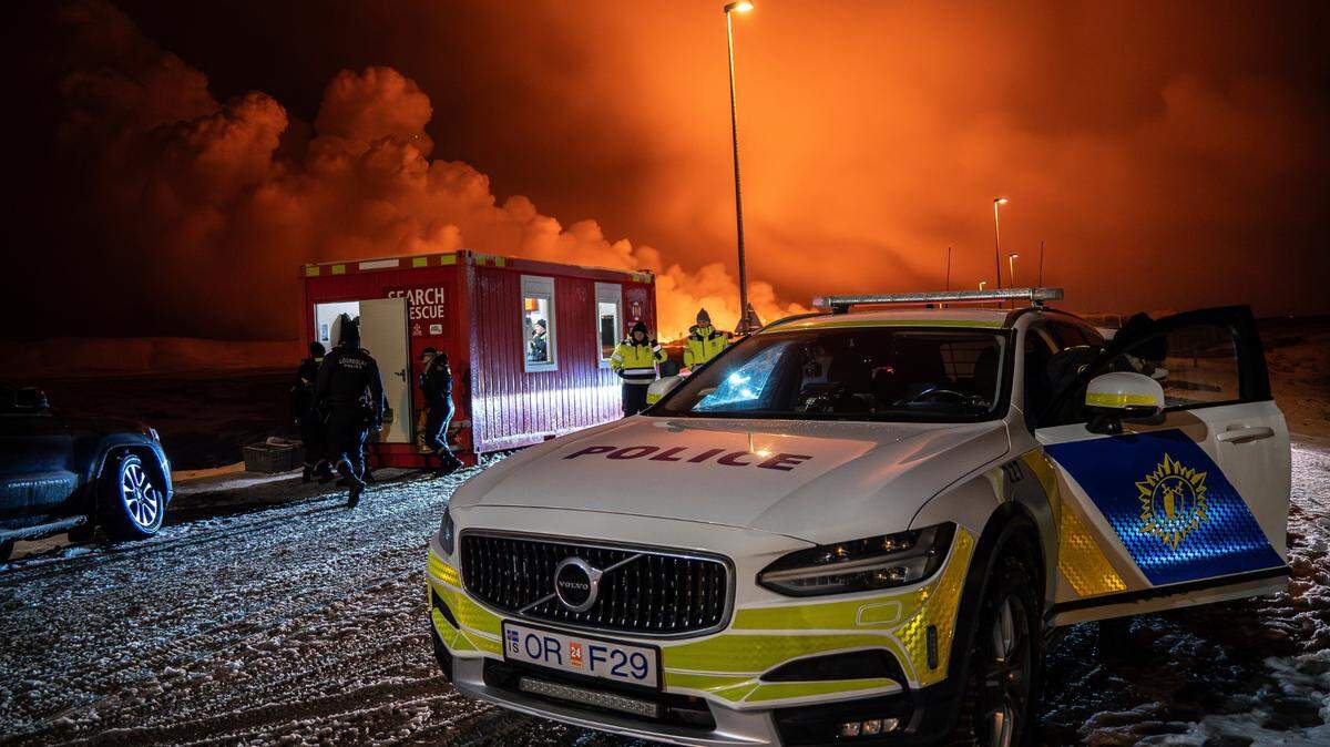 A police vehicle is parked at the entrance of the road to Grindavík with the eruption in the background, near Grindavik on Iceland’s Reykjanes Peninsula earlier this month.