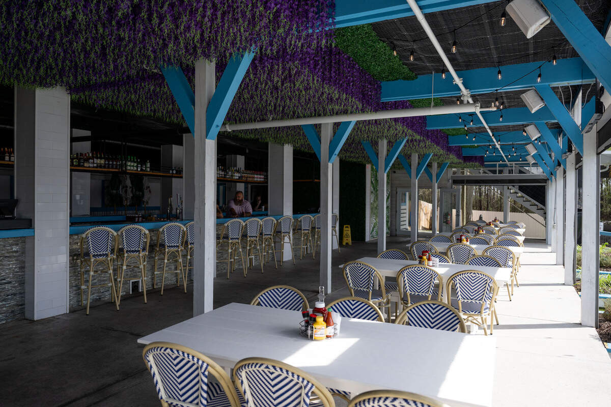 The outdoor dining area and bar at Bacchus on the Bluff in Gulfport are at the edge of the bayou, where customers can arrive by boat.