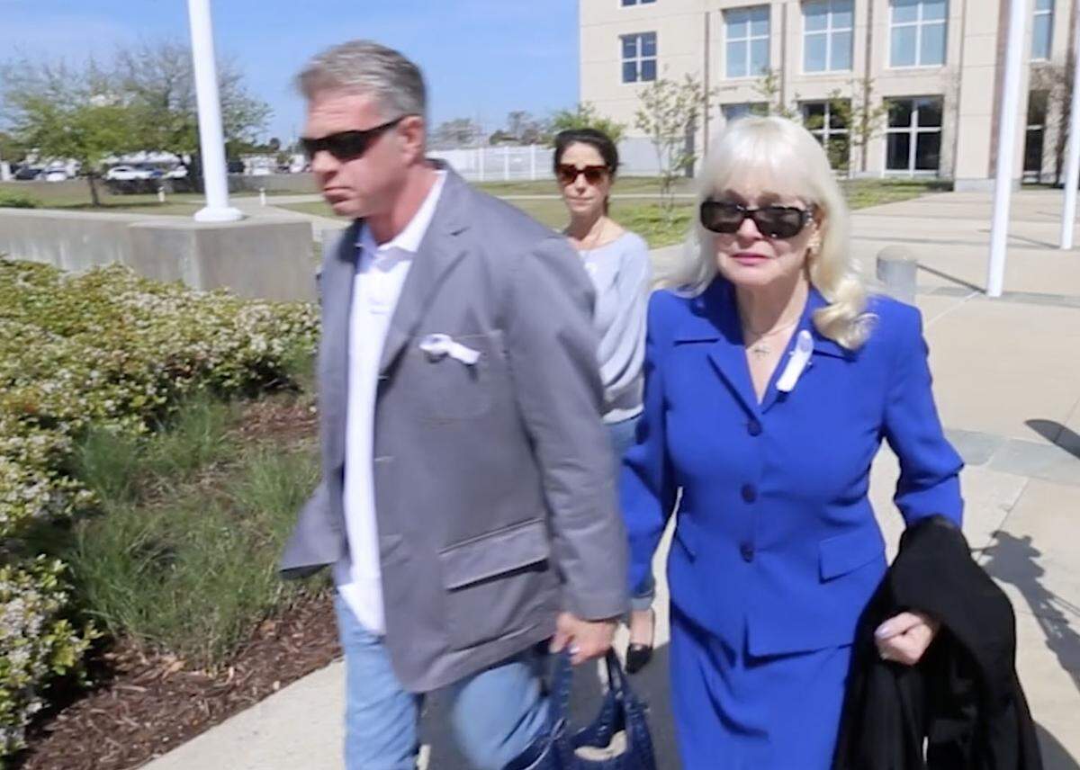 Kay Diaz, right, leaves the federal courthouse in Gulfport after a hearing in March 2018 to determine if her husband, Dr. Albert Diaz, could be released from jail before he was sentenced. The request was rejected.