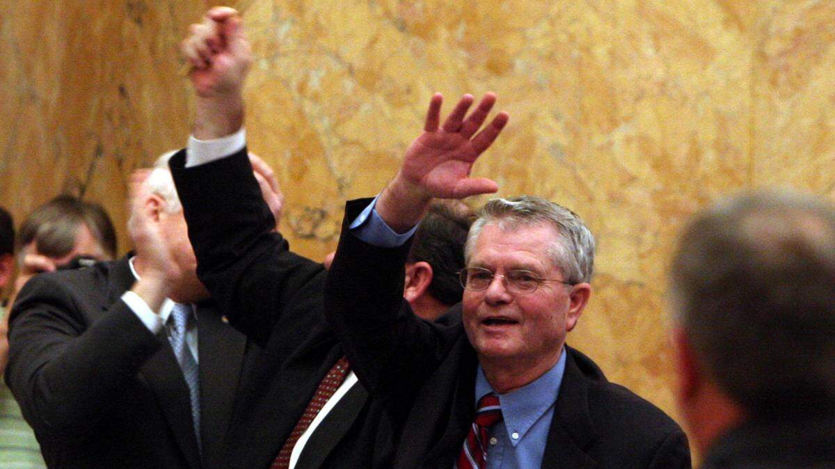 
William J. "Billy McCoy "  acknowledges the applause of his
fellow House  members Tuesday morning after he was re-elected as the
Speaker of the House.
