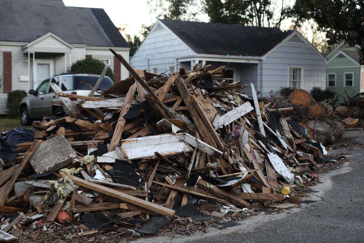 Piles of debris, downed trees and rubble line the Broadmoor neighborhood in Gulfport nearly two months after Hurricane Zeta hit South Mississippi.