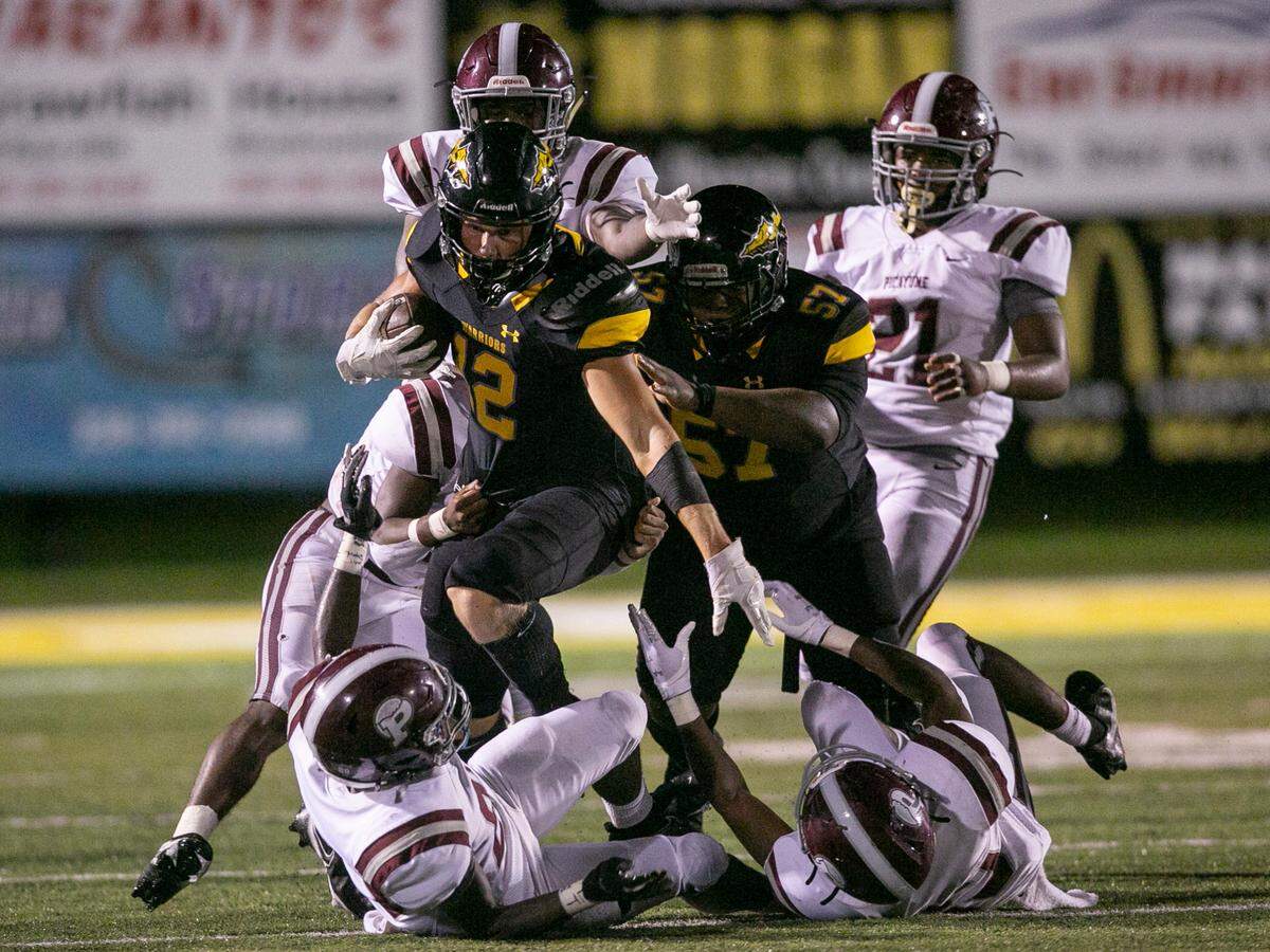 D’Iberville’s Colton Deshazo is tackled by Picayune as he carries the ball down the field during the D’Iberville versus Picayune game at D’Iberville Stadium on Friday, Sept. 17, 2021.