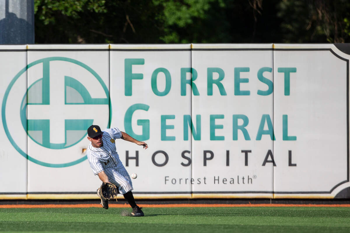 Southern Miss’s Gabe Montenegro goes for a ground ball in the outfield during the NCAA Regionals at Pete Taylor Park in Hattiesburg on Monday, June 6, 2022.