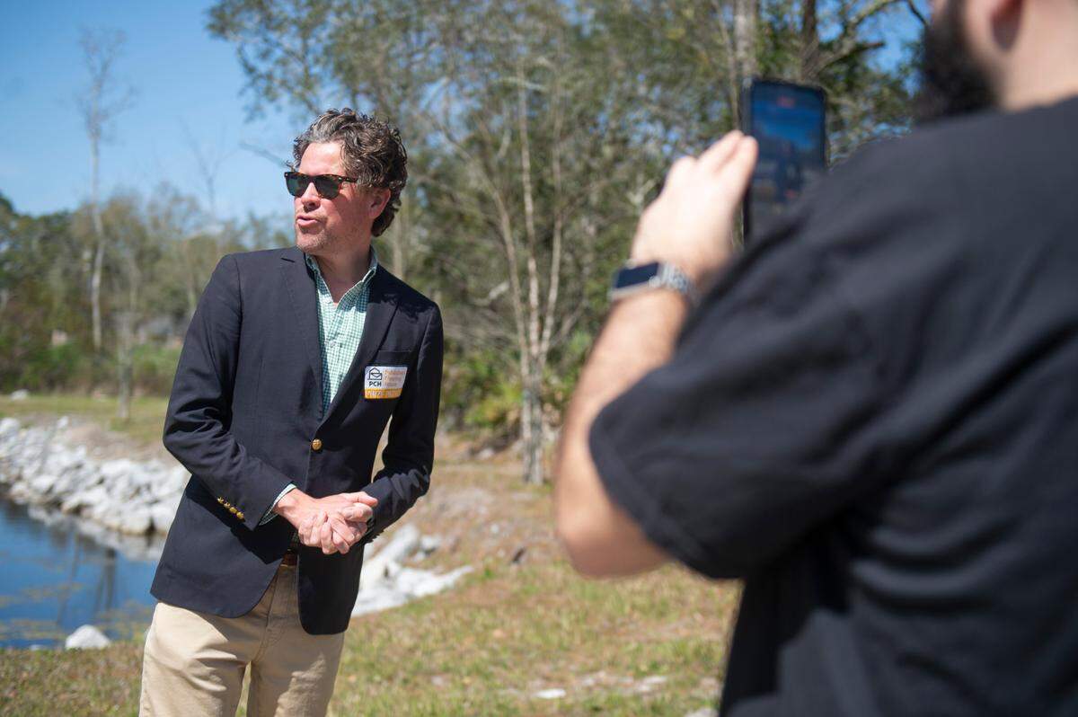 Publishers Clearing House Prize Patrol member Howie Guja and his cameraman film videos prior to delivering a prize to Timothy Bomar in Ocean Springs on Wednesday, March 19, 2025.