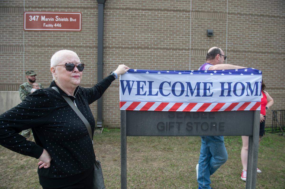 Dawn Riedel awaits the arrival of her son Jared Anton, a members of Naval Mobile Construction Battalion 1, as the battalion returns home from deployment on Thursday, March 13, 2025, to Naval Construction Battalion Center Gulfport.
