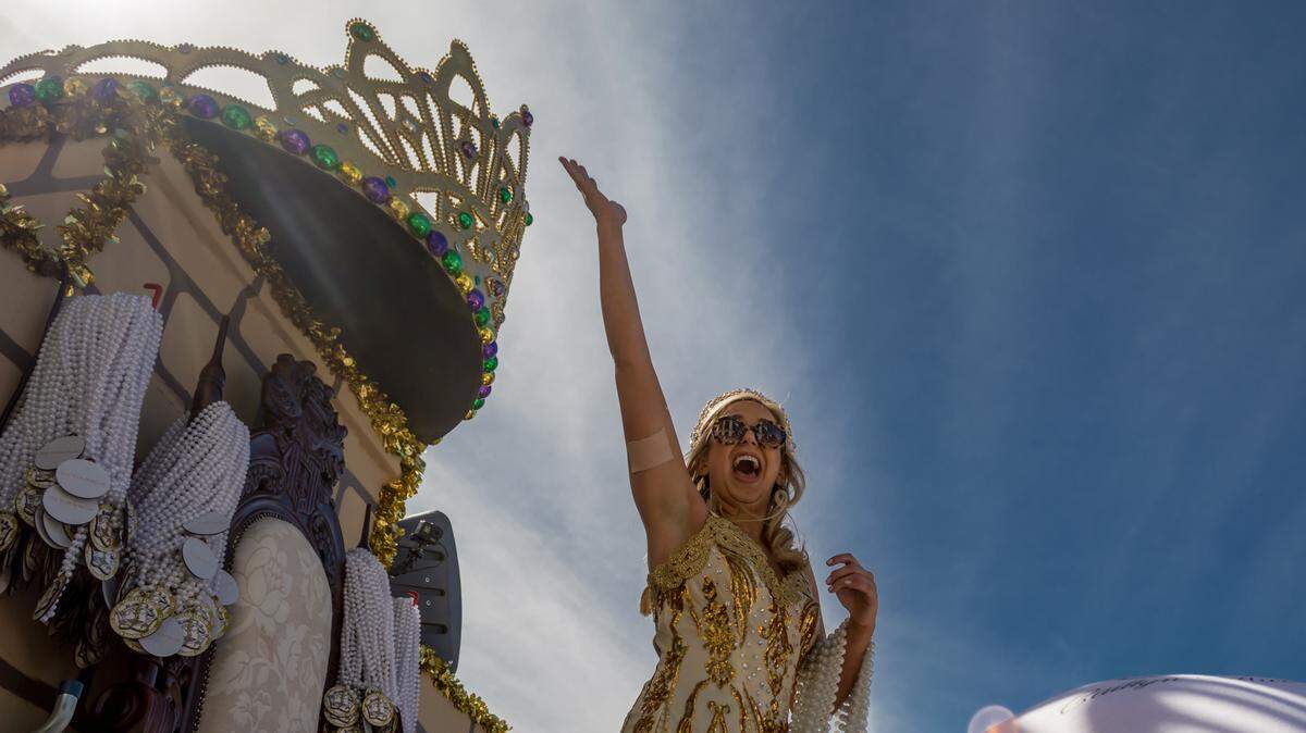 Queen Ixilob Caitlyn Marie Lesso waves to crowds during the Gulf Coast Carnival Association Mardi Gras parade on Tuesday, March 5, 2019.