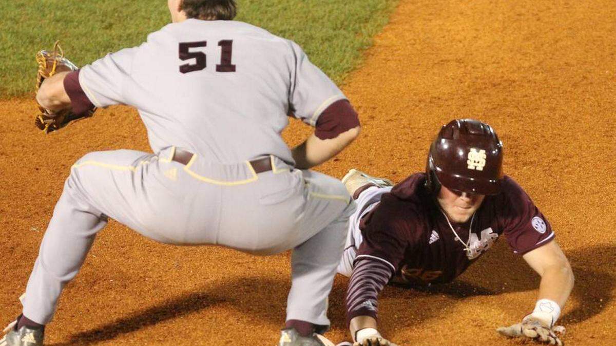 JOHN FITZHUGH/SUN HERALD 
 Mississippi State outfielder Cody Brown, right, and the Bulldogs travel to Auburn this weekend.