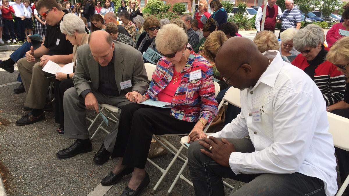 CHRISTINA STEUBE/SUN HERALD/FILE 
 Residents worship at Ocean Springs City Hall during the 2014 National Day of Prayer.