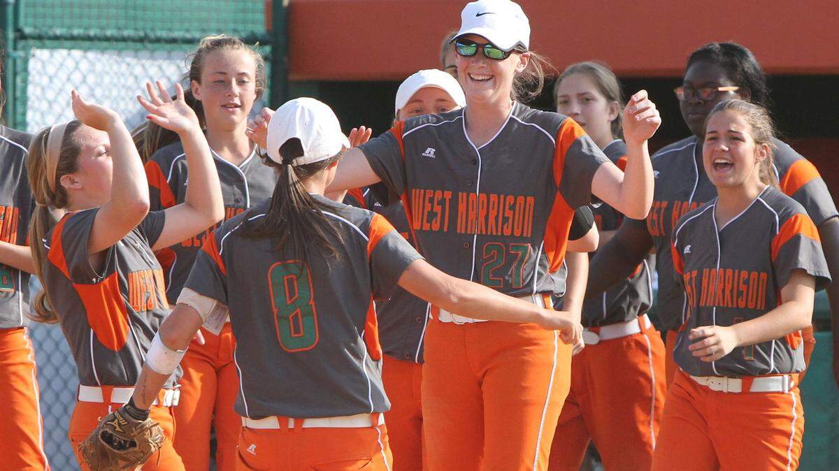 JOHN FITZHUGH/SUN HERALDWest Harrison players gather around pitcher, Stephanie Necaise, after their 5A softball playoff win over Picayune at West Harrison on April 29. The Lady Hurricanes play Pearl River Central in South State beginning Friday.