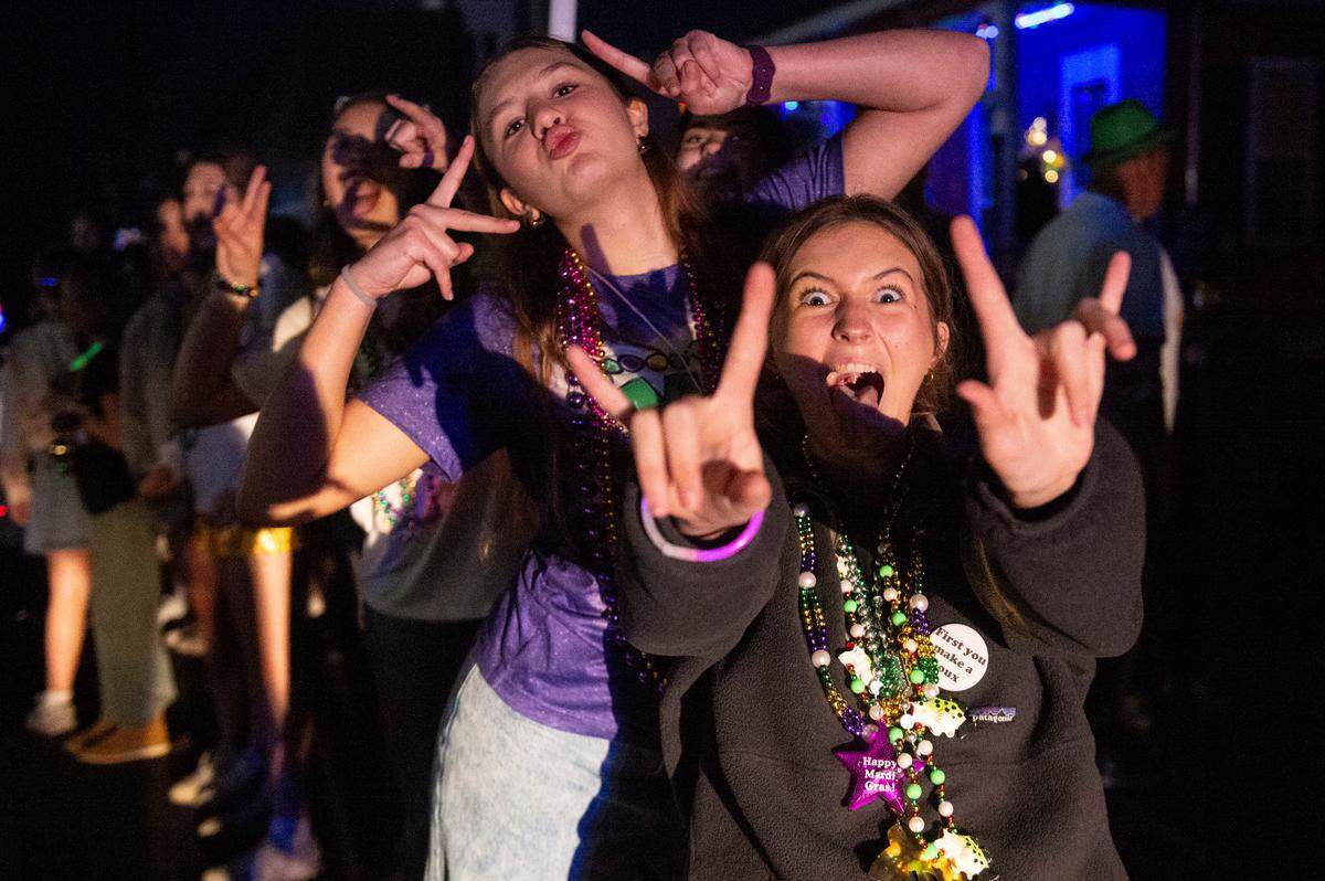 Kids cheer for beads during Mystic Krewe of the Seahorse’s Lundi Gras parade in Bay St. Louis on Monday, March 3, 2025.