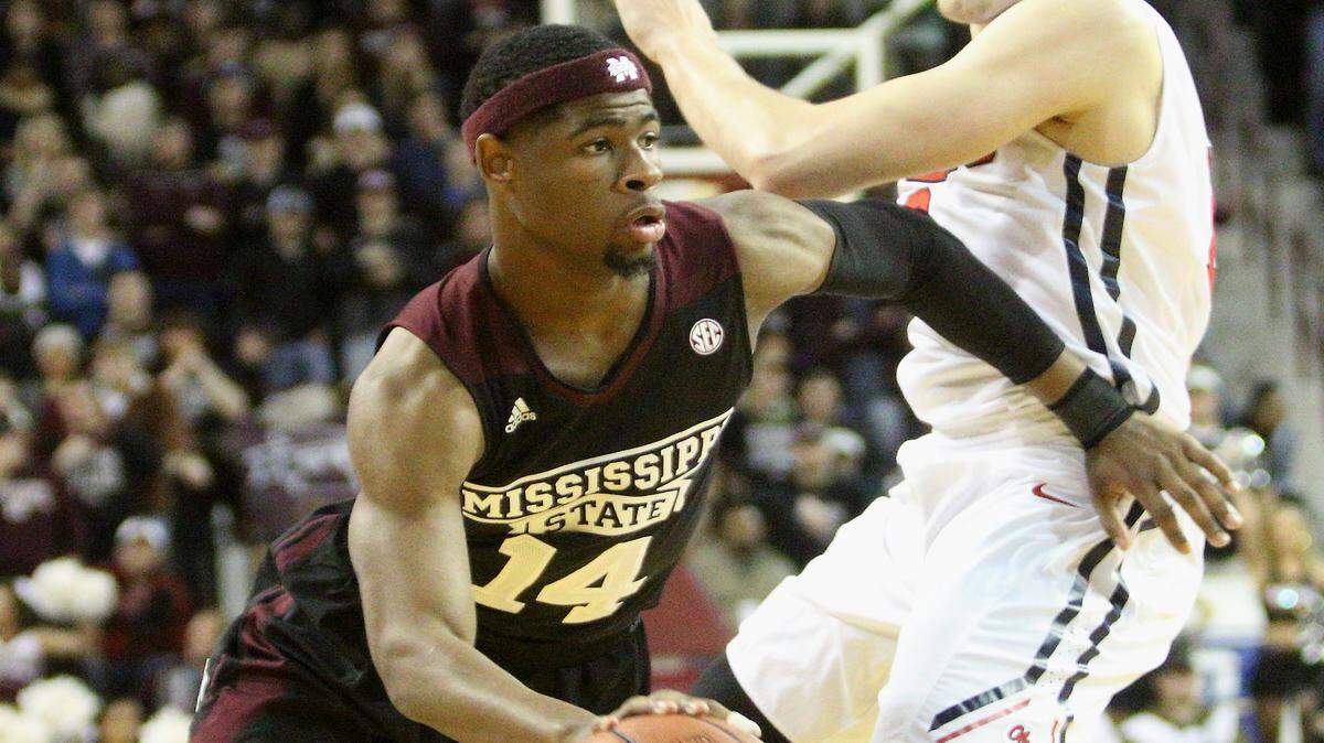 Mississippi State guard Malik Newman (14) drives to the basket and around Mississippi forward Tomasz Gielo (12) during the first half of an NCAA college basketball game in Starkville, Miss., Saturday, Jan. 23, 2016. Mississippi State won 83-77. (AP Photo/Jim Lytle)