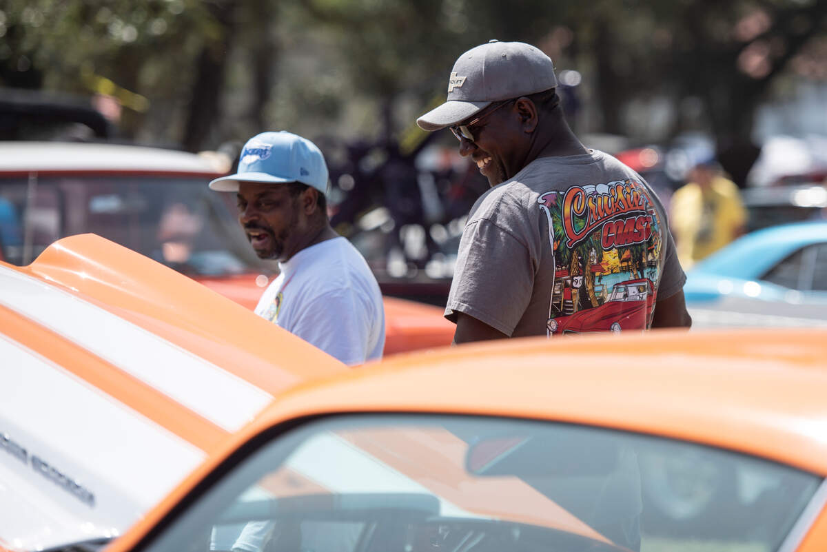 Spectators look at classic cars at Cruisin’ Central at Centennial Plaza during Cruisin’ the Coast on Tuesday, Oct. 3, 2023.