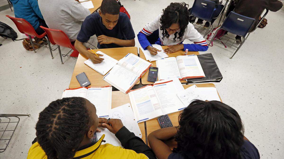 ROGELIO V. SOLIS/ASSOCIATED PRESS 
 Clarksdale High School students delve into the complexities of math.