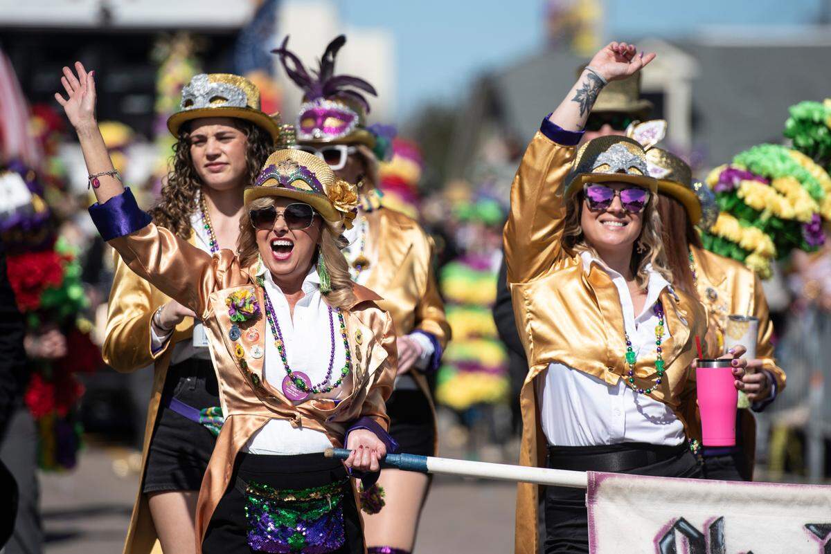 The Ole Biloxi Marching Club marches during the Gulf Coast Carnival Association’s Mardi Gras parade in Biloxi on Tuesday, Feb. 13, 2024.