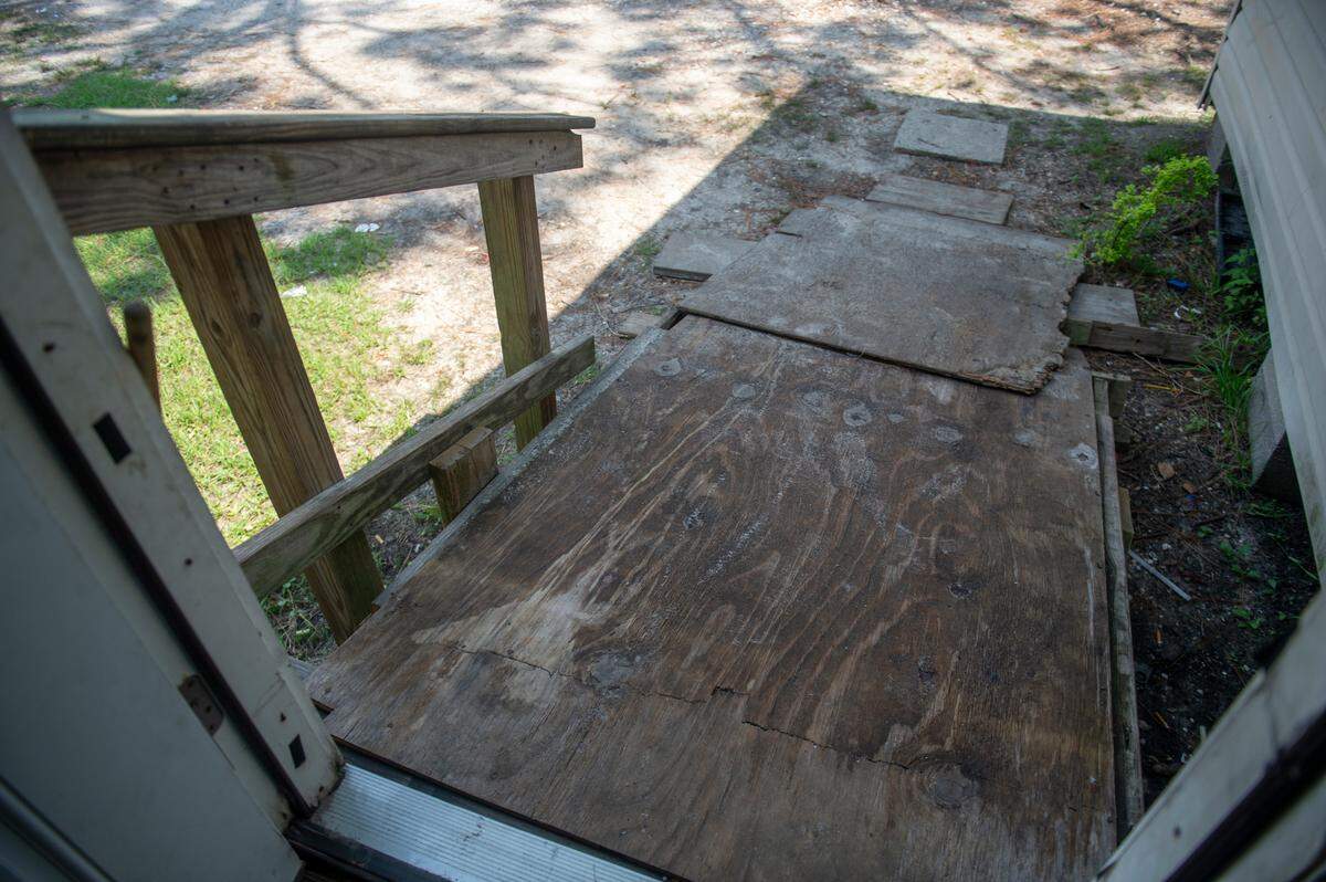 A wooden makeshift wheelchair ramp at Antrease Bullock’s home in Gulfport on Monday, June 10, 2024. The ramp, which was built by a neighbor using scrap wood, will finally be replaced with a metal ramp after Bullock pushed for help for years.