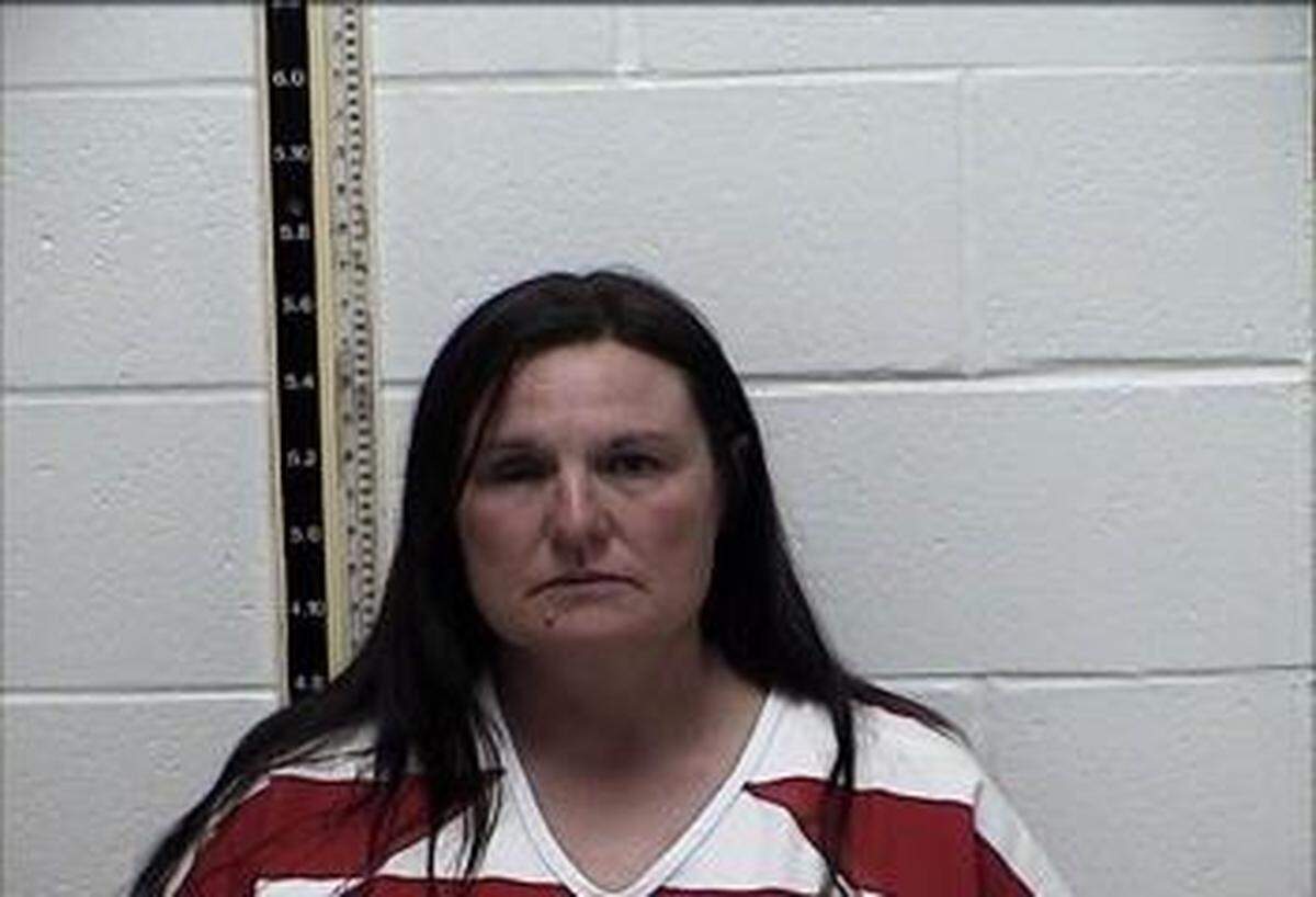 Tanya Lindell Saucier, 49, is held in the Pearl River County jail on a murder charge in connection to her estranged husband’s shooting outside the courthouse.