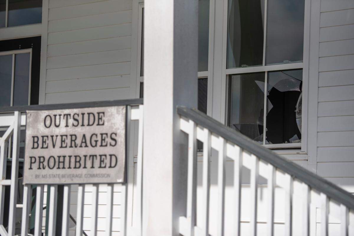 A broken window in the front of the former clubhouse of Great Southern Golf Club on Wednesday, Nov. 9, 2022. The club, which closed in May, is supposed to be developed into housing developments but neighbors are concerned about the environmental impact.