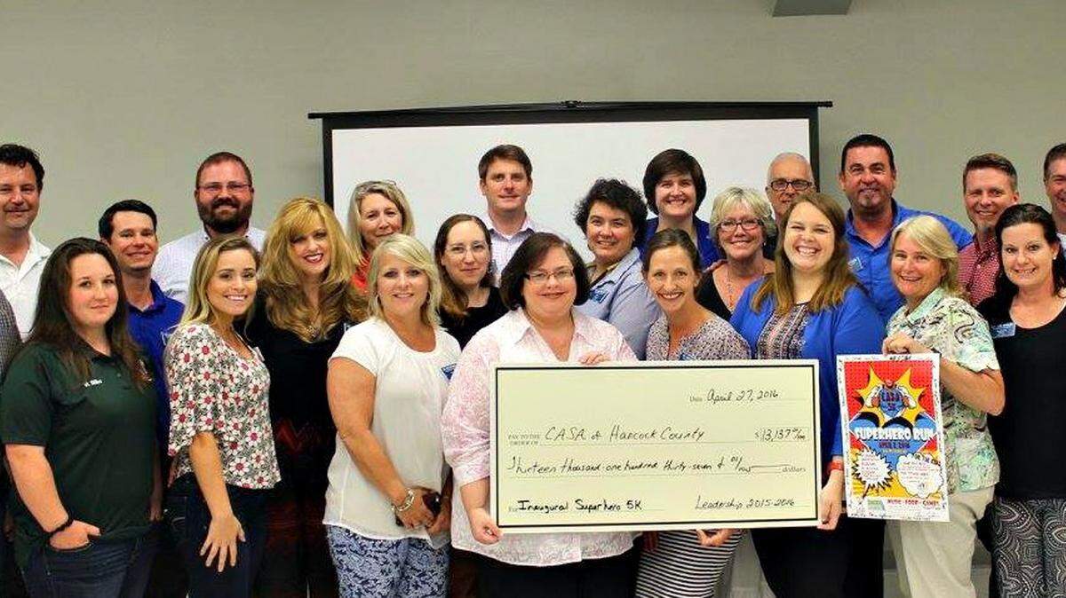 HANCOCK CHAMBER 
 Leadership Hancock County presents a check for $13,137 to CASA, or Court Appointed Special Advocates of Hancock County. The money wsa raised by the first CASA Superhero 5K Run.