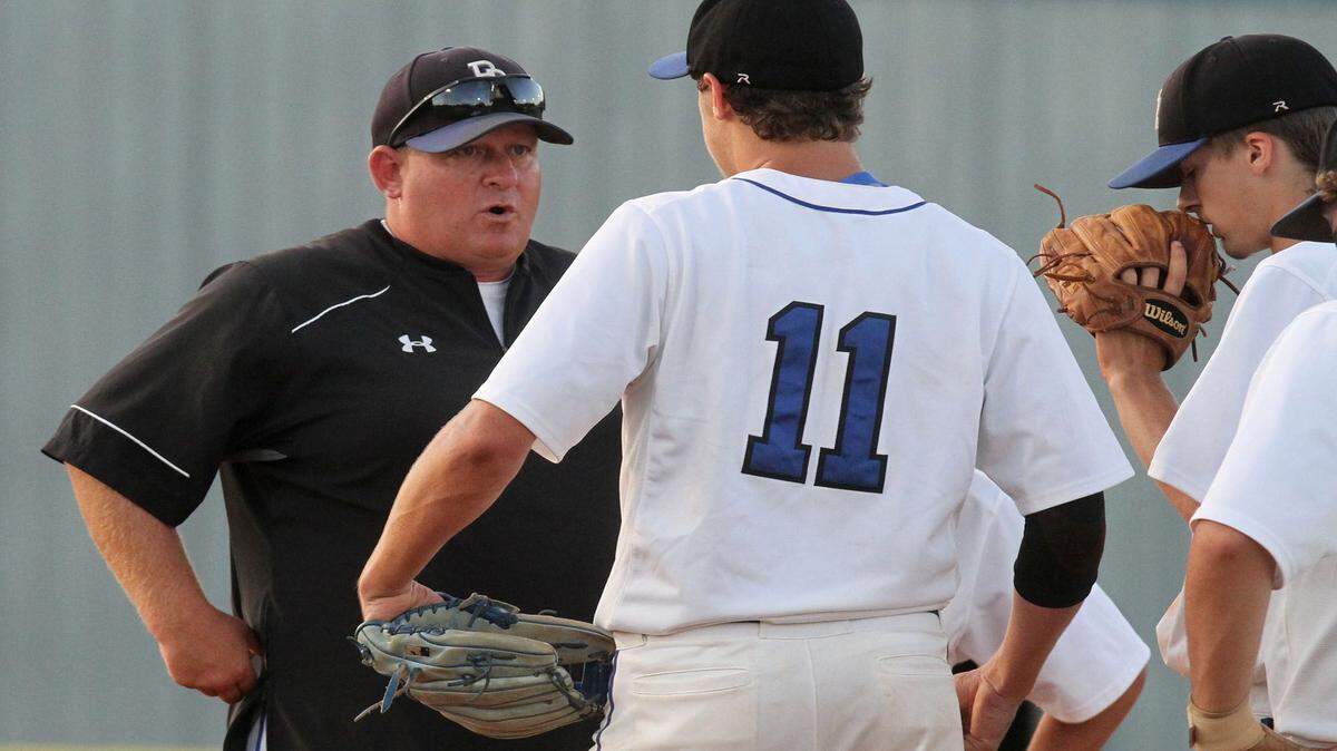JOHN FITZHUGH/SUN HERALDPearl River Central coach Neil Walther talks to his starting pitcher, Cade Lee, during the second inning of their 5A South State playoff game against Hattiesburg in Carriere on Friday.