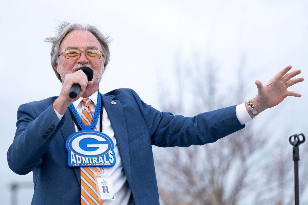 Gulfport Mayor Hugh Keating congratulates the Gulfport football team during the Champions Christmas Parade in Gulfport on Monday, Dec. 8, 2025.
