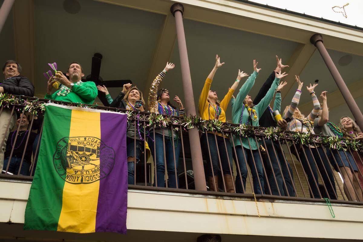 Crowds lined up on downtown Biloxi restaurant balconies on Fat Tuesday, Feb. 25, 2020.
