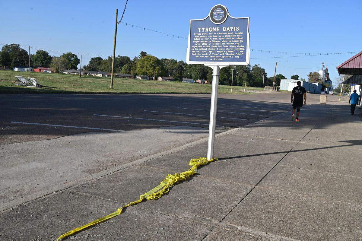 Crime scene tape remains at the scene on North Main Streets in Leland, Monday, Oct. 13, 2025, where a shooting resulted in multiple fatalities during a homecoming celebration.