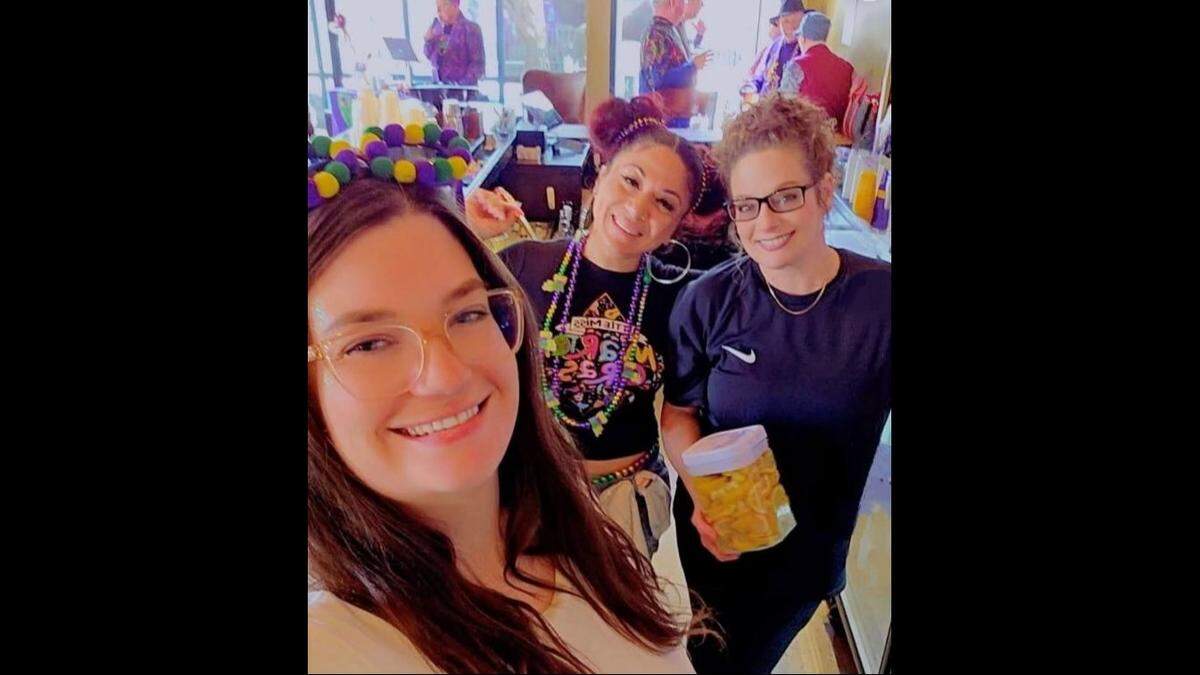 Joyce Gomez (center) is seen with fellow employees at Whiskey Bar, where she worked three or four nights a week.