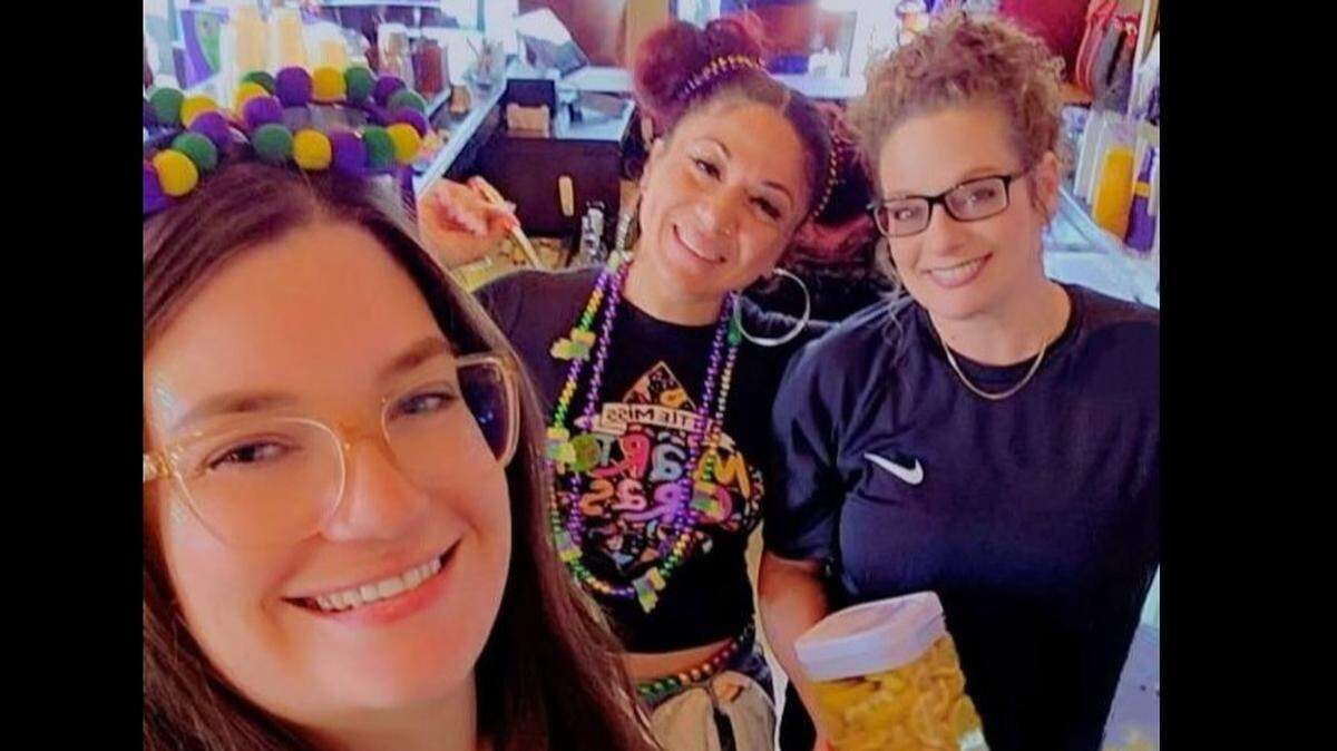 Joyce Gomez (center) is seen with fellow employees at Whiskey Bar, where she worked three or four nights a week.