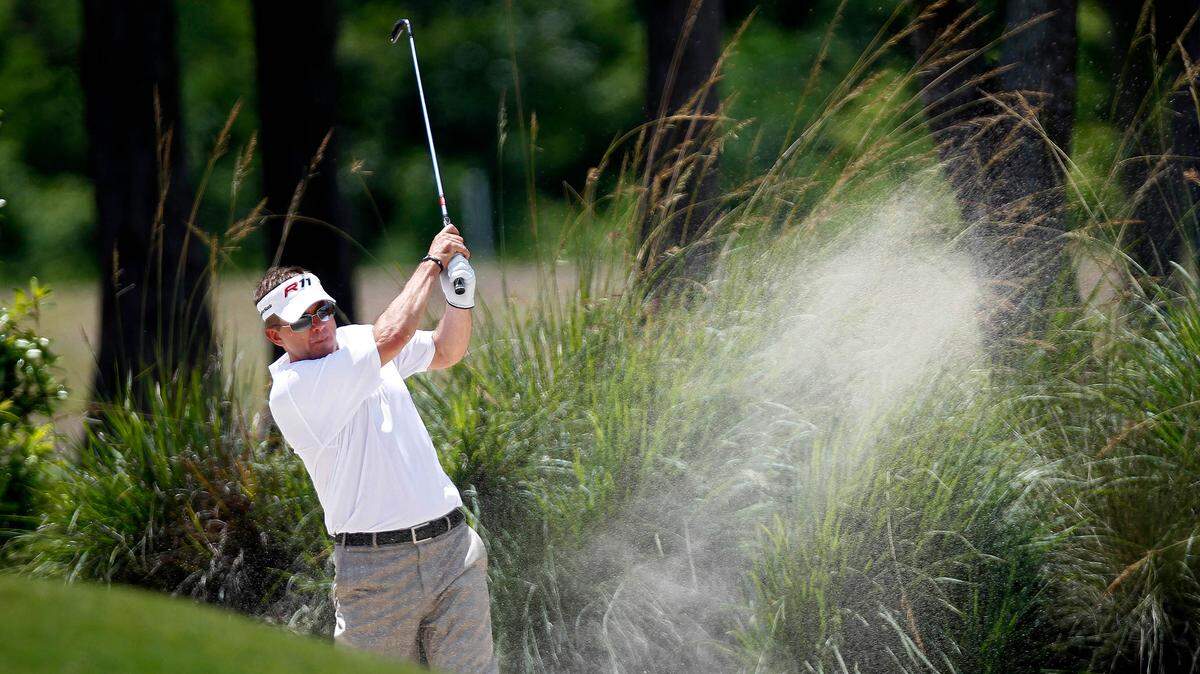 New Orleans Saints NFL football head coach Sean Payton hits out of a sand trap during the Pro-Am rounds of the PGA golf Zurich Classic at TPC Louisiana in Avondale, La. in 2012. Here's hoping Payton has better luck on the links this week.