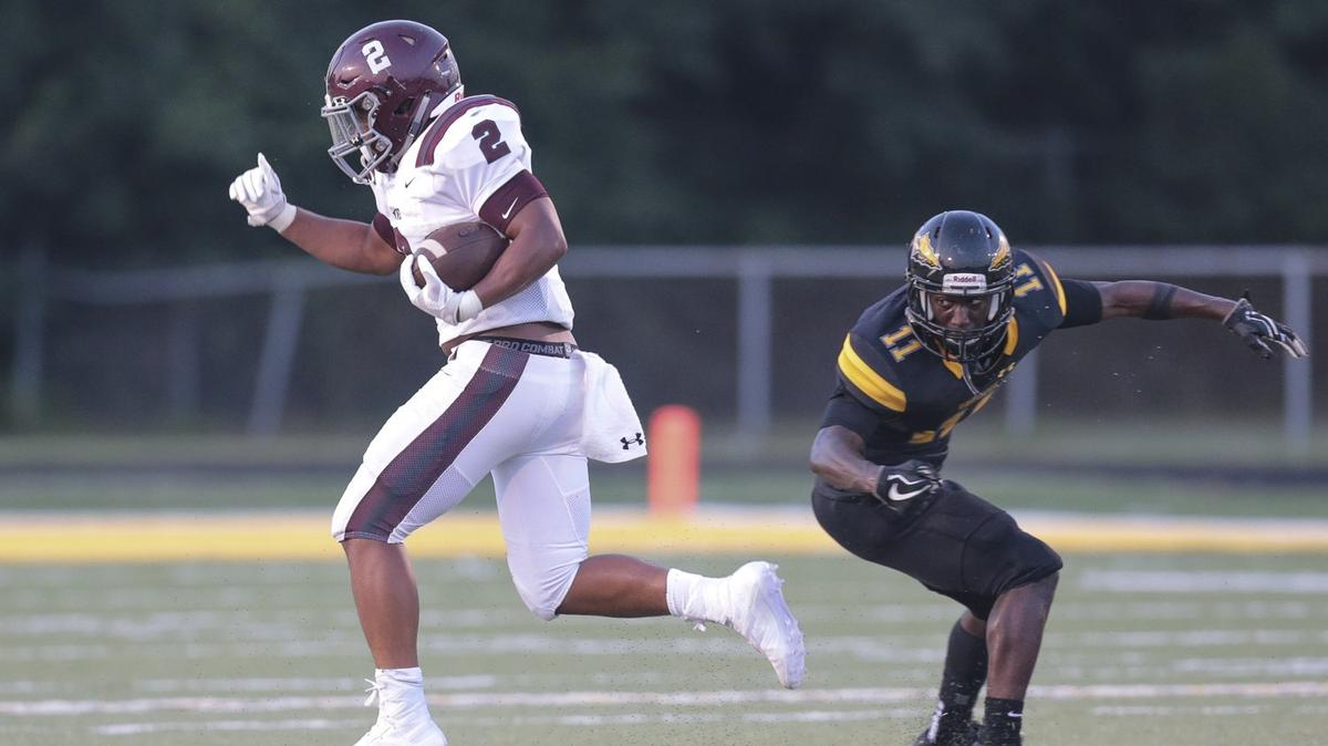 Jortin Raine (2) gets around cornerback Cory Hathorn (11) for a long gain during the Picayune at D’Iberville game, Friday, August 24, 2018.