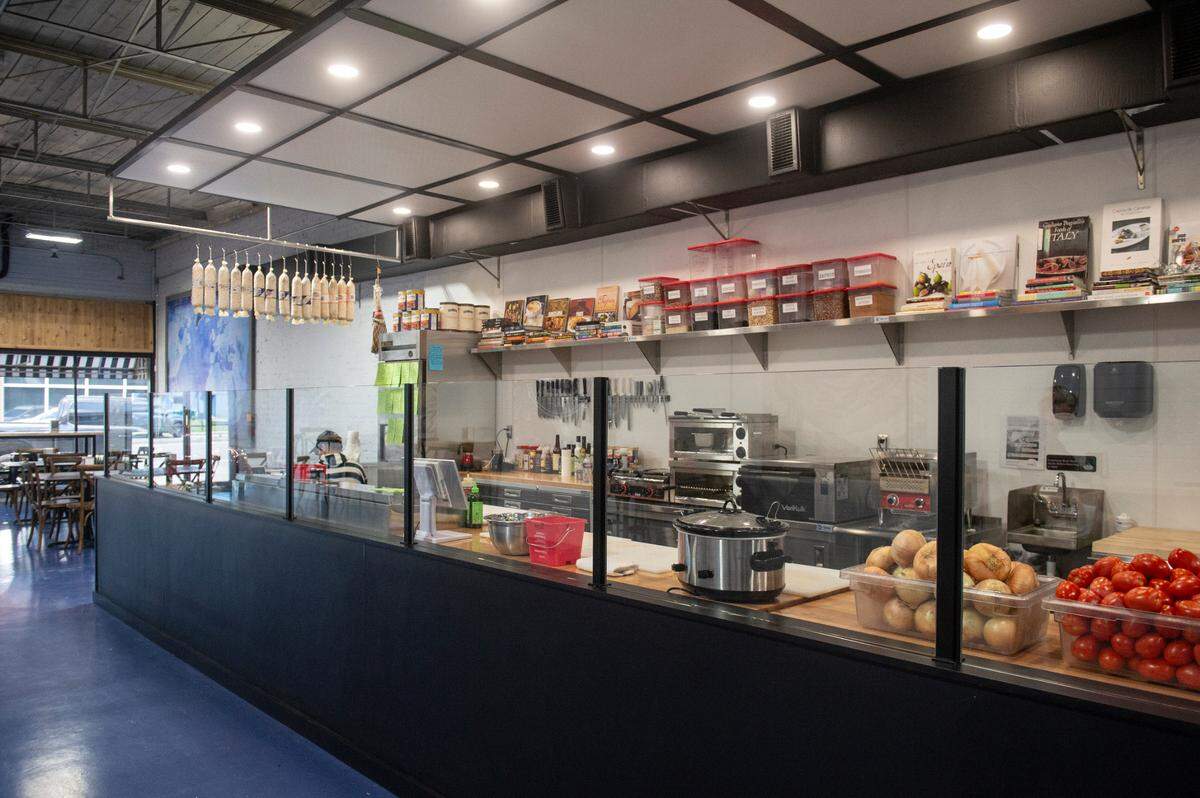 The food preparation area at Tavi’s Salumeria in Gulfport, which opens Tuesday, shows the imported equipment and ingredients used to create Euripean sandwiches.