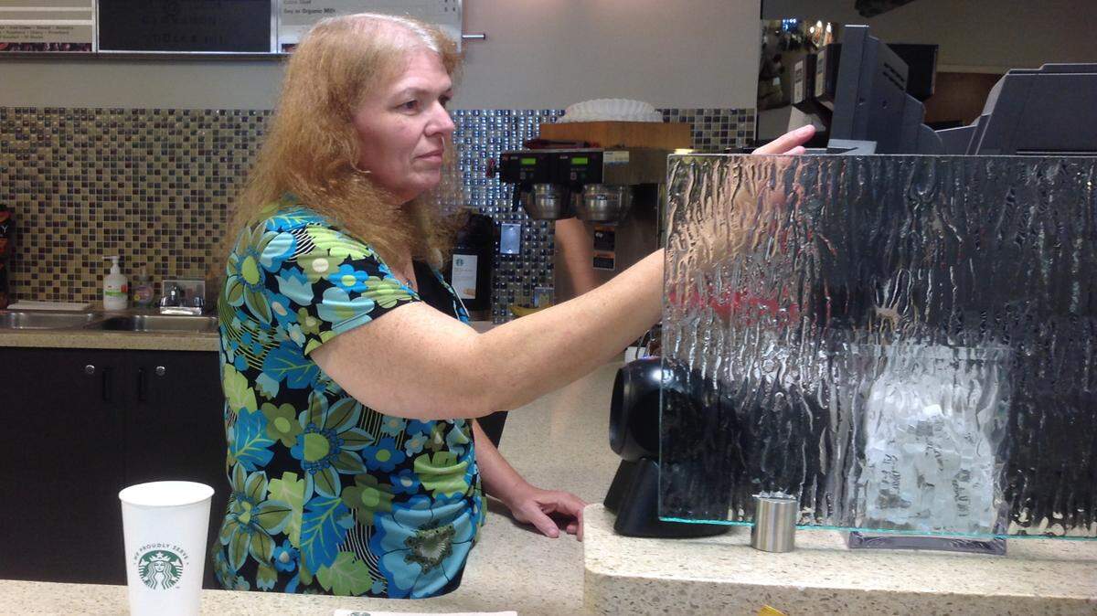 KAREN NELSON 
 Connie Anderson works at the River Cafe selling Starbucks in the Singing River Medical Park. The little-known Starbucks has expanded its hours to accommodate a later crowd.