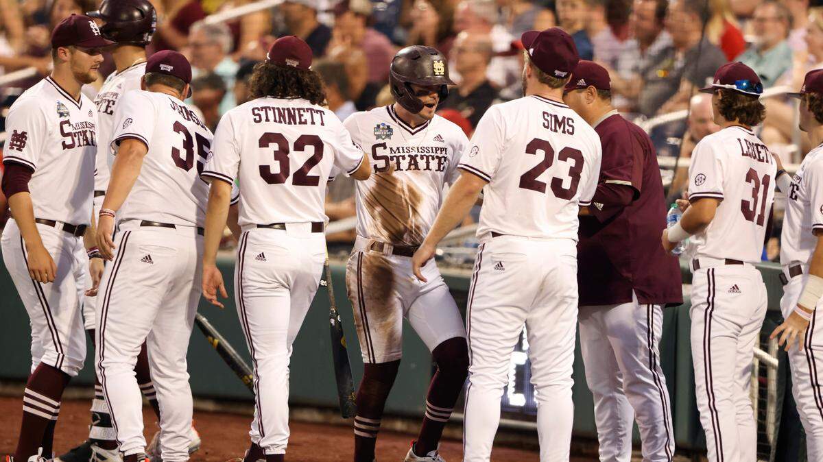 Mississippi State’s Tanner Allen, center, celebrates with teammates after scoring a run during the third inning against Vanderbilt in Game 2 of the NCAA College World Series baseball finals, Tuesday, June 29, 2021, in Omaha, Neb. (AP Photo/Rebecca S. Gratz)