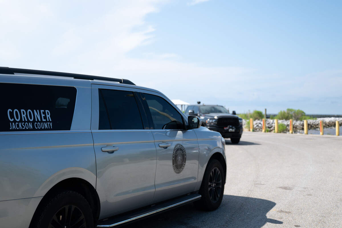 A car form the Jackson County Coroner drives into Lake Mars Boat Launch on Monday, July 6, 2026.