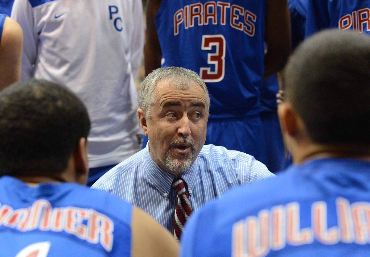 Head coach Buddy Kennedy talks to his players during a time out.