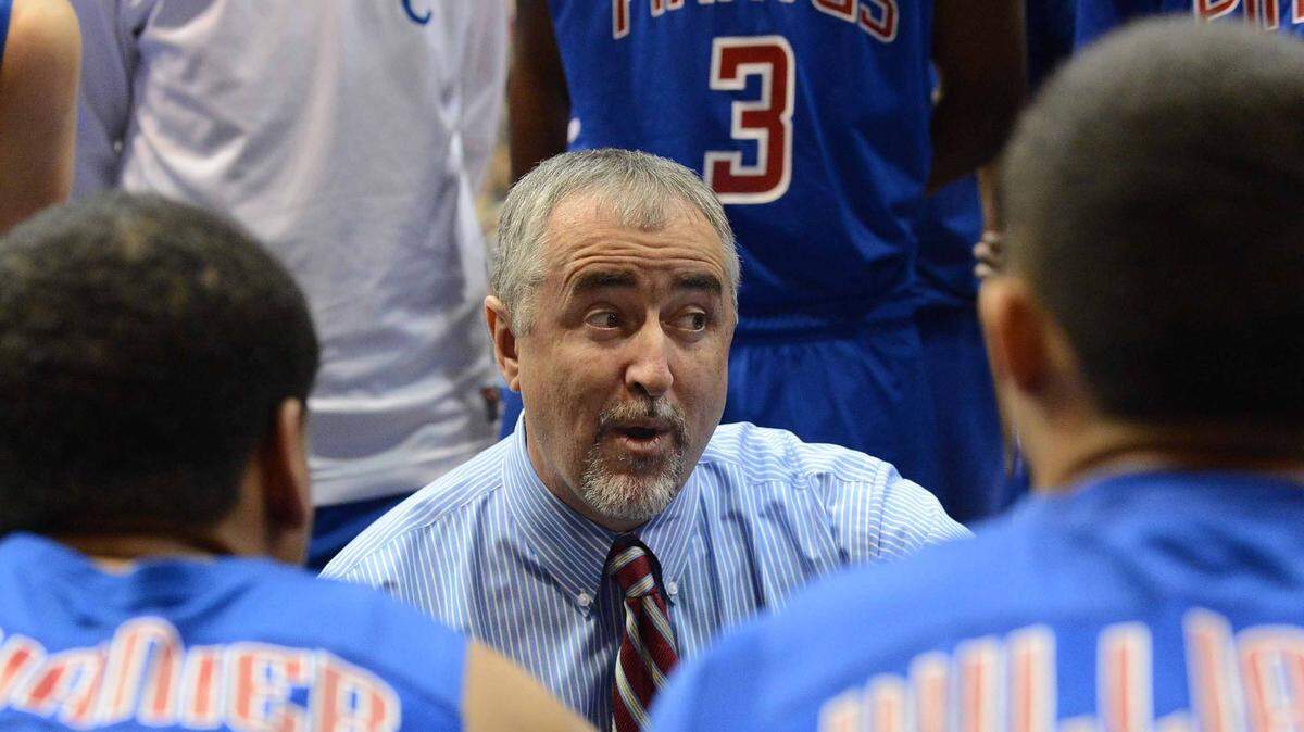 Head coach Buddy Kennedy talks to his players during a time out.
