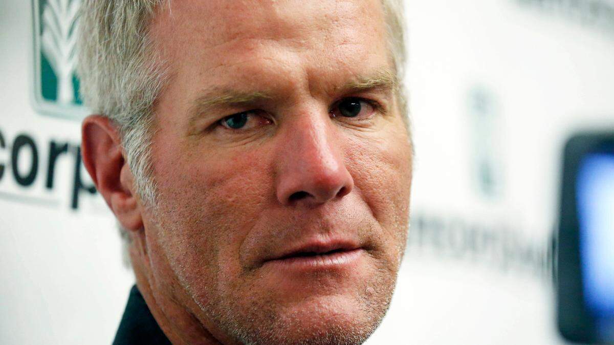 Former NFL quarterback Brett Favre speaks with reporters prior to his induction to the Mississippi Hall of Fame in Jackson in 2015. Mississippi’s state auditor filed court papers Monday renewing his call for Favre to repay the state for welfare money that the auditor says was improperly spent on projects backed by the retired NFL quarterback.