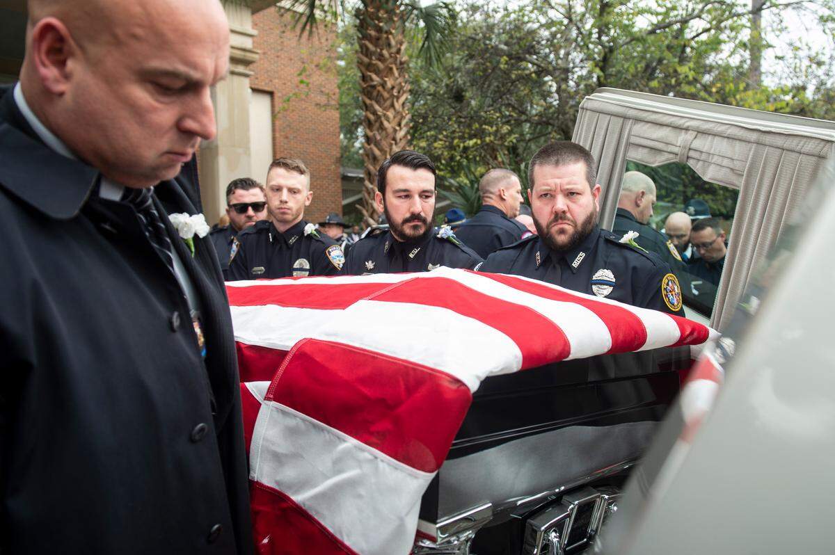 Law enforcement officers carry the caskets of Bay St. Louis police officers Sgt. Steven Robin and Branden Estorffe out to hearses following their funeral at the Bay St. Louis Community Center in Bay St. Louis on Wednesday, Dec. 21, 2022. Robin and Estorffe were killed responding to a call at a Motel 6 on Dec. 14.
