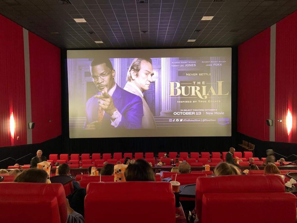 With popcorn and beverages at the ready, people settled into their seats at Premiere Lux cinema in Biloxi Tuesday at a special premiere showing of “The Burial.” The movie is based on a lawsuit brought by the late Jeremiah O’Keefe, a Coast funeral director.