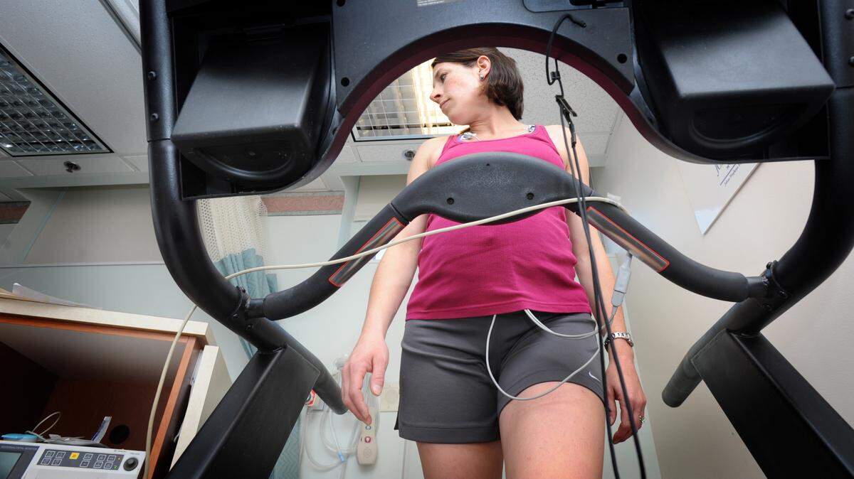 Meredith Dobrosielski, 36, right, exercises on a treadmill in Dr. Andrew Satin's lab as part of a health study about pregnant women and the effects of exercise, November 1, 2010, in Baltimore, Maryland. Dobrosielski was an avid runner for several years and is now in her 31st week of pregnancy. (Algerina Perna/Baltimore Sun/MCT)