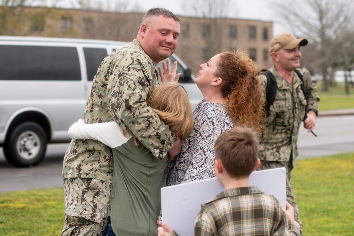 Members of Naval Mobile Construction Battalion 133 reunite with their families after returning from deployment at a homecoming event at the Naval Construction Battalion Center in Gulfport on Tuesday, March 5, 2024.