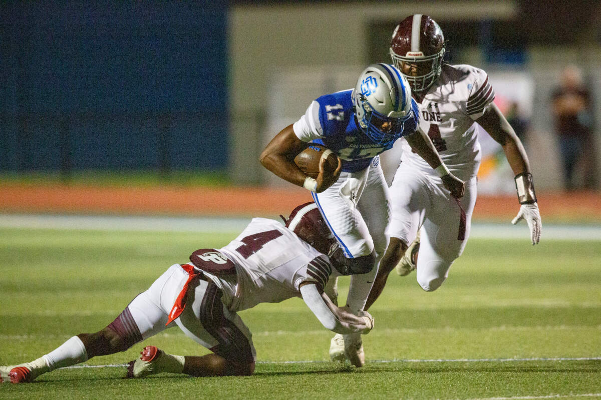 Picayune’s Darrell Smith tackles Ocean Springs’ quarterback Connor White during a game between Picayune and Ocean Springs at Greyhound Stadium in Ocean Springs on Friday, Sept. 27, 2024.
