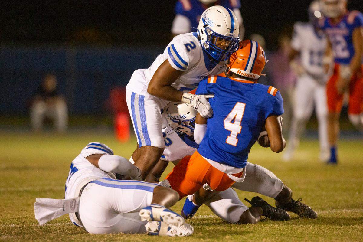 Ocean Springs’ Trace Carter tackles Gulfport’s Krisjeohn Burks during a game against Gulfport at Milner Stadium in Gulfport on Friday, Oct. 27, 2023. Ocean Springs beat Gulfport 30-7.