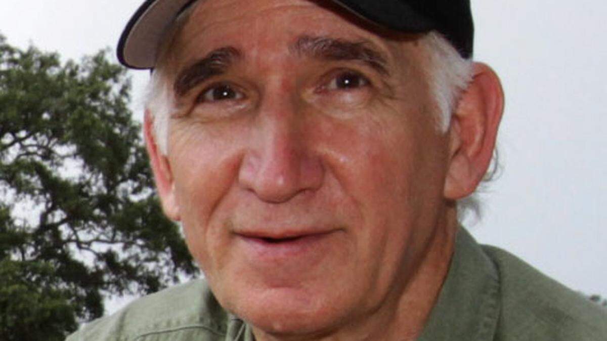 Hancock County Coroner Jim Faulk narrowly won reelection in Tuesday’s runoff.