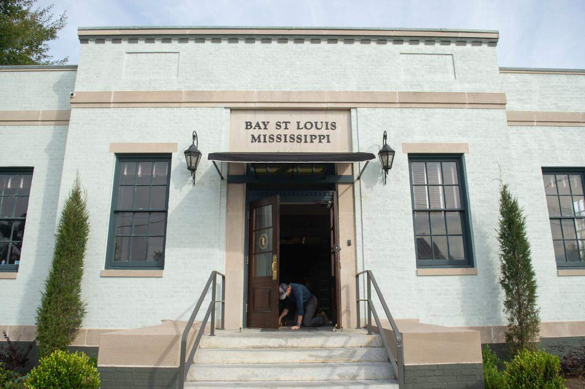 Shane LeBlanc works on his new menswear shop, Fairly Local, in the old post office building in Bay St. Louis on Thursday, Dec. 7, 2023. The shop, which is the second in a small chain, will have an in-store barber shop, coffee shop, humidor for cigars and a variety of menswear brands.