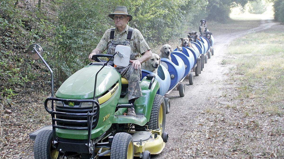 BOB WORTH/TNSEugene Bostick takes eight dogs for a ride around the property in Fort Worth, Texas. Bostick drives the dogs around the 12-acre property about two to three times a week.